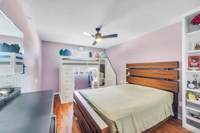 a bathroom with a sink vanity mirror and tub