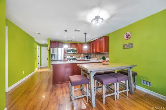 a view of a dining room with furniture and a table