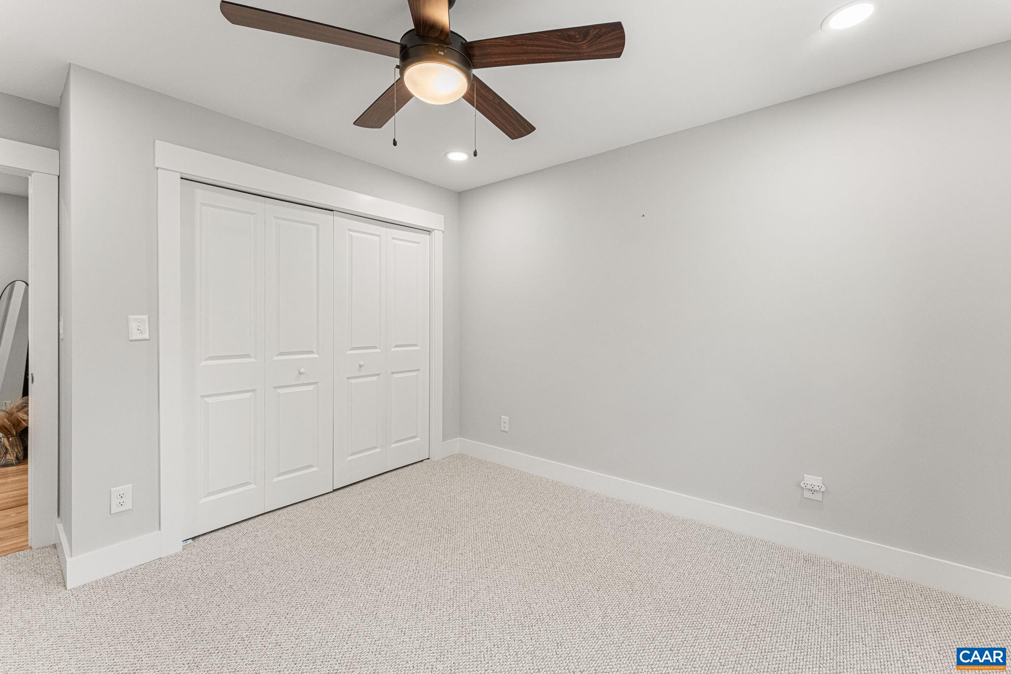 230 Fox Hollow Road Ruckersville, VA 22968 - Photo 33 of 42 an empty room with a ceiling fan and a window