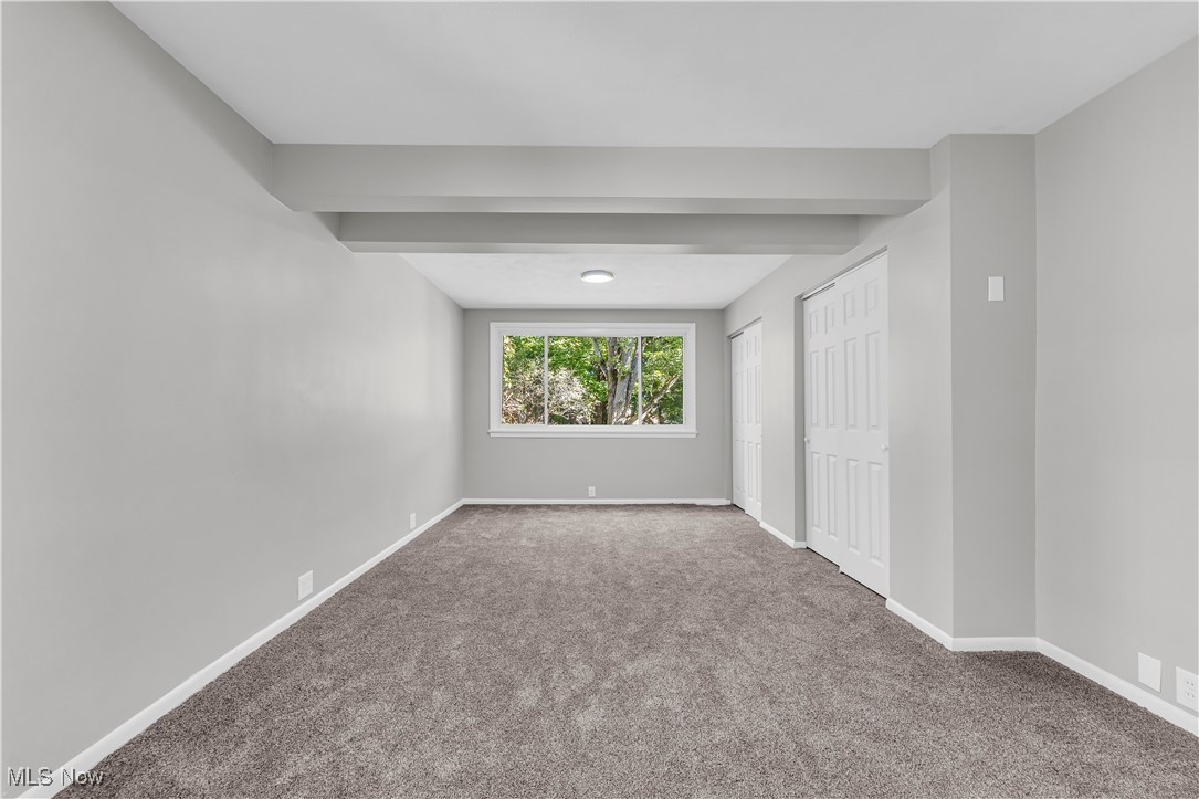 2425 Canterbury Road Cleveland Heights, OH 44118 - Photo 23 of 33 Carpeted empty room featuring beamed ceiling