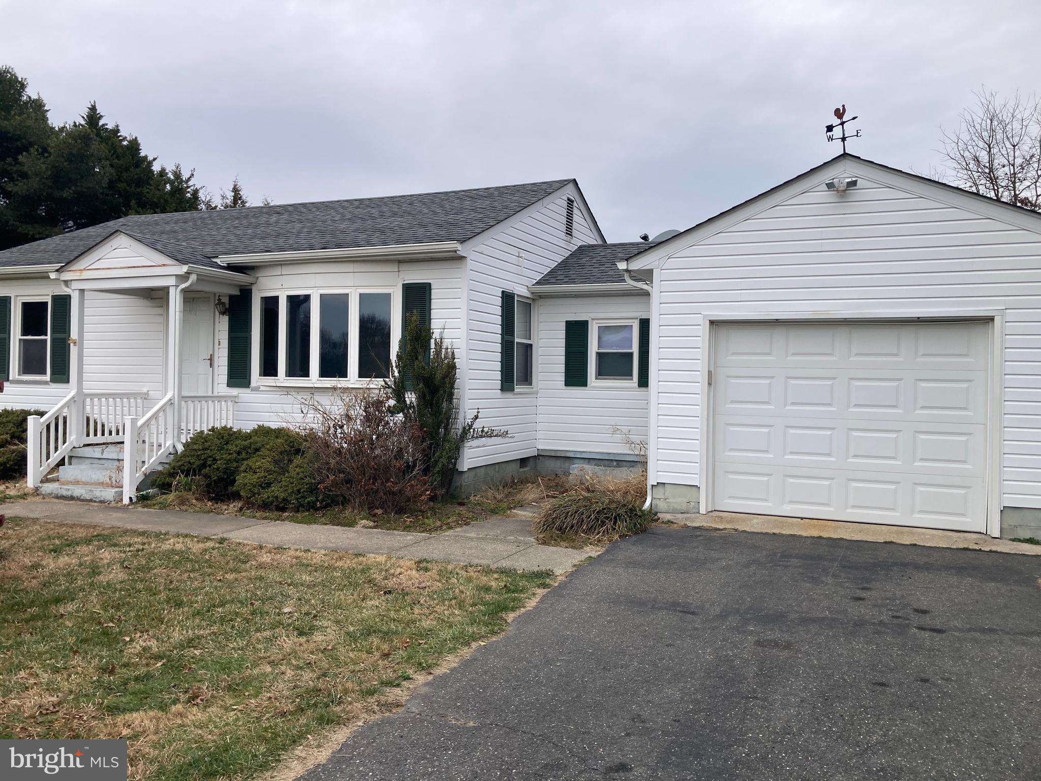 30294 Rabbit Hill Road Easton, MD 21601 - Photo 1 of 6 a front view of a house with a yard