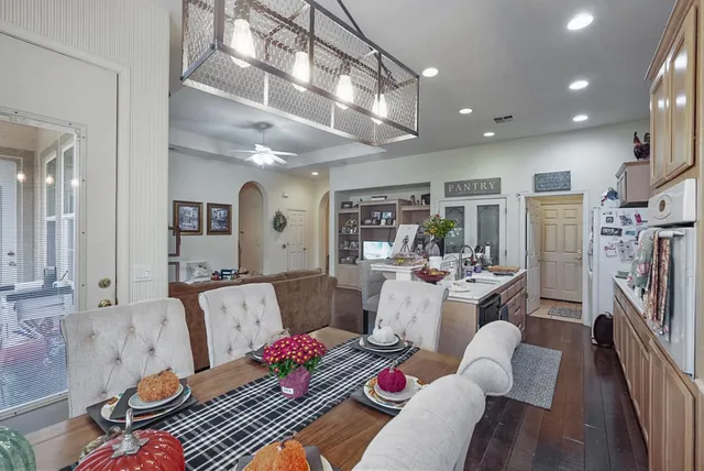a living room with furniture fireplace and a flat screen tv