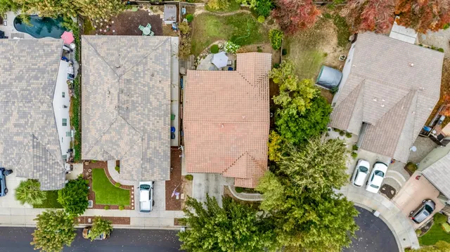 an aerial view of a house with outdoor space