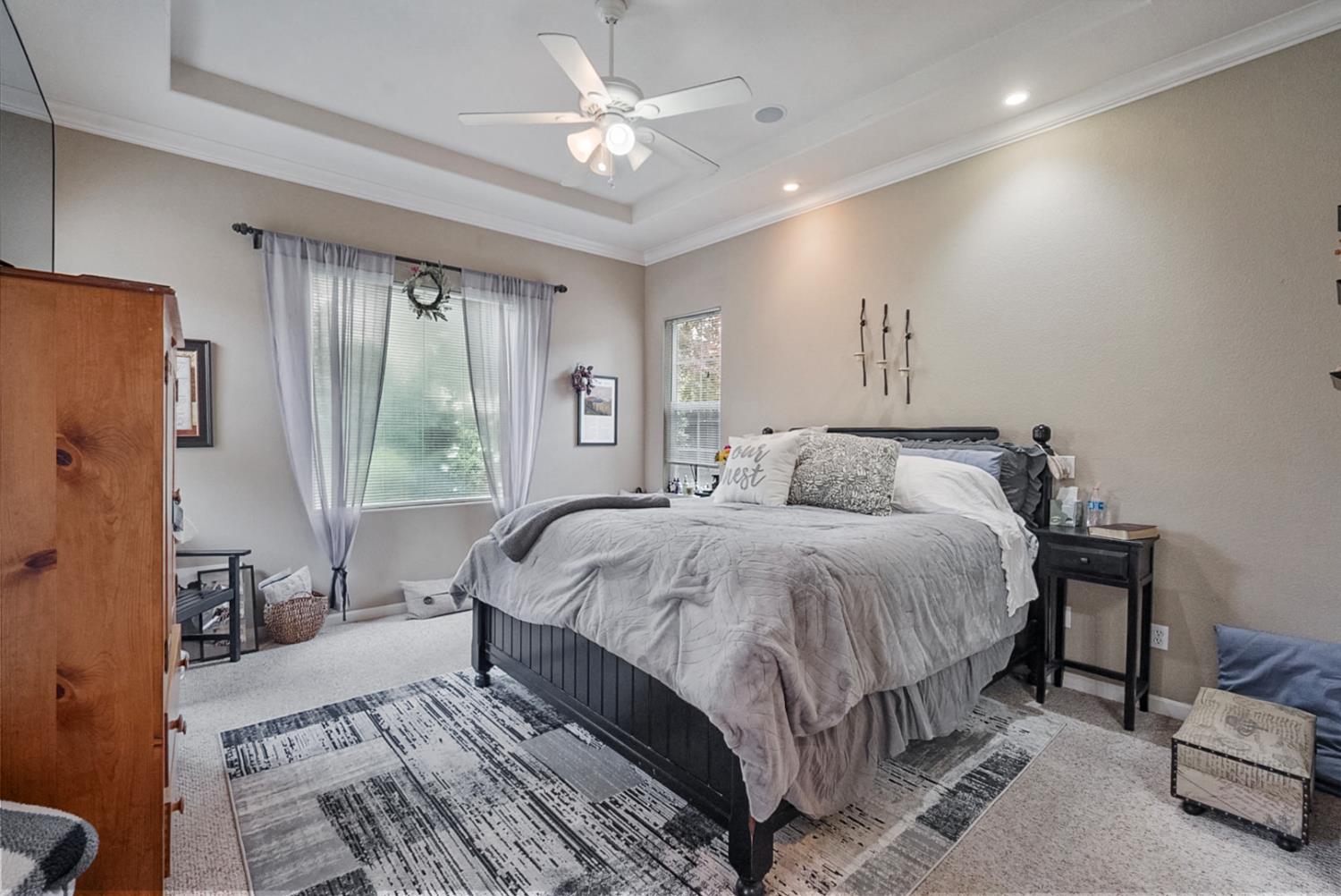 191 Fall Avenue Patterson, CA 95363 - Photo 3 of 31 a spacious bedroom with a bed a couch and a large window