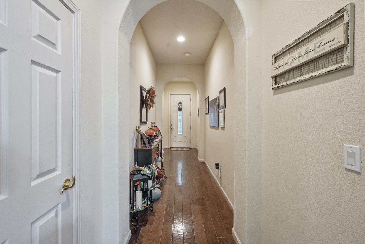 191 Fall Avenue Patterson, CA 95363 - Photo 7 of 31 a view of a hallway with wooden floor and closet