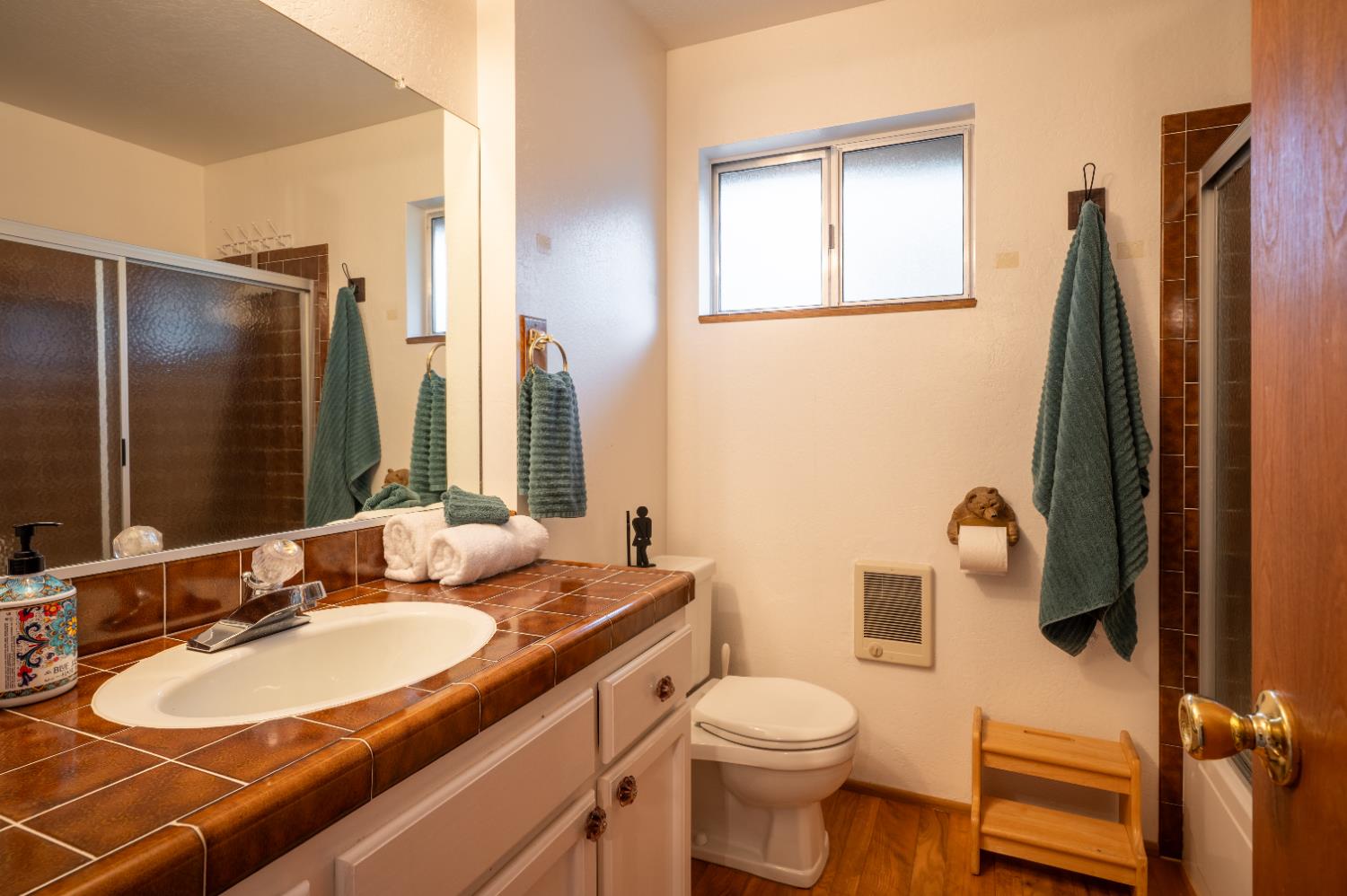 3790 Apache Road Arnold, CA 95223 - Photo 14 of 41 a bathroom with a sink a toilet and a mirror