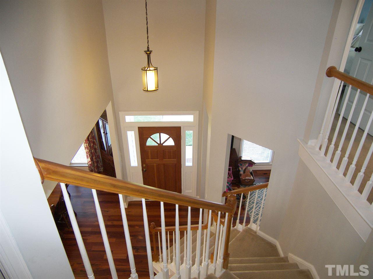 11933 Fairlie Place Raleigh, NC 27613 - Photo 2 of 25 a view of entryway and hall with wooden floor