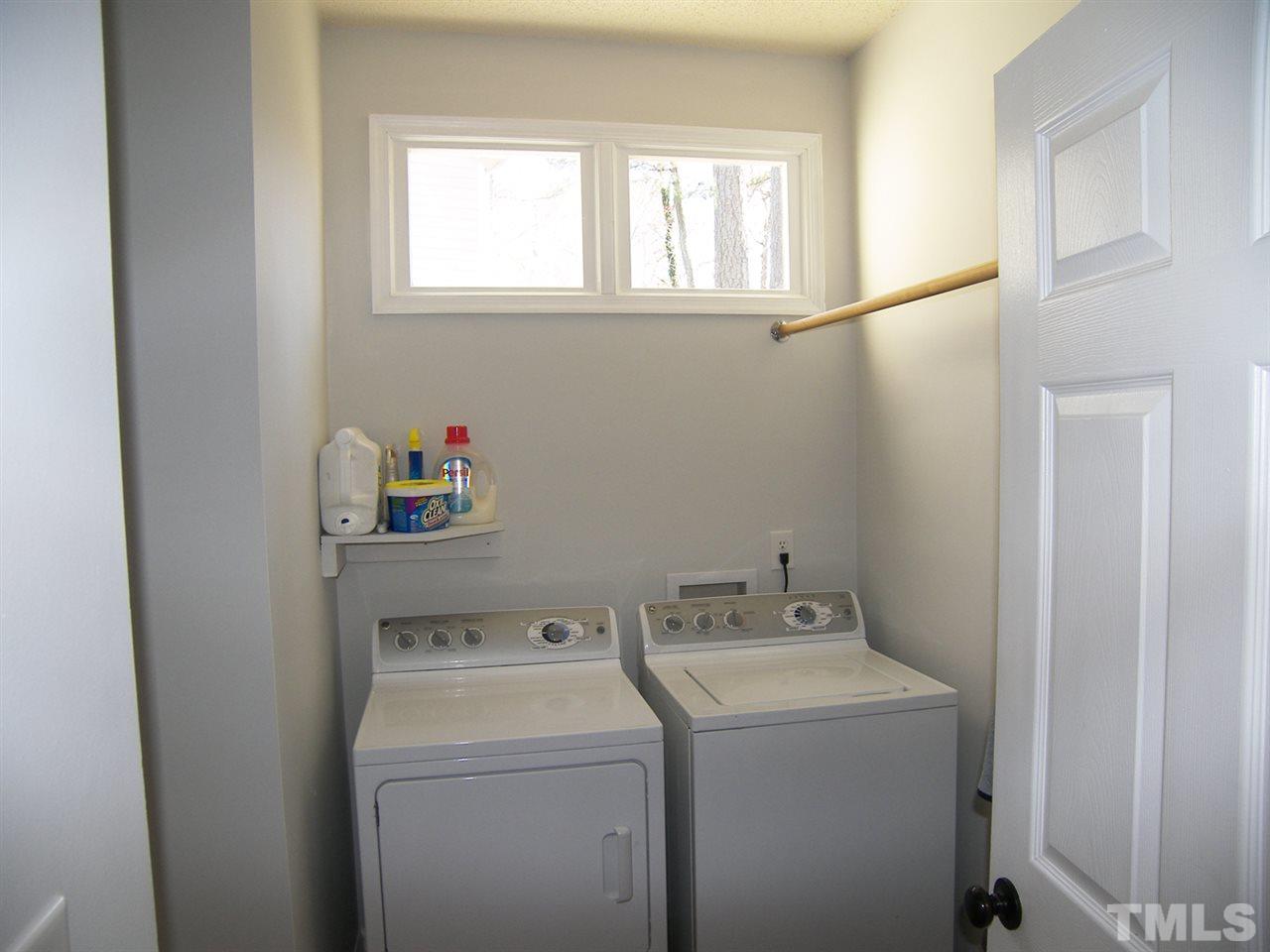 11933 Fairlie Place Raleigh, NC 27613 - Photo 19 of 25 a utility room with dryer and washer