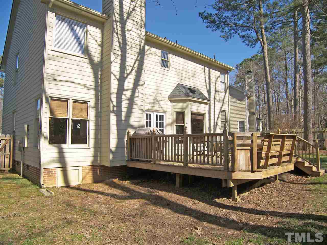11933 Fairlie Place Raleigh, NC 27613 - Photo 24 of 25 a view of a house with a wooden deck