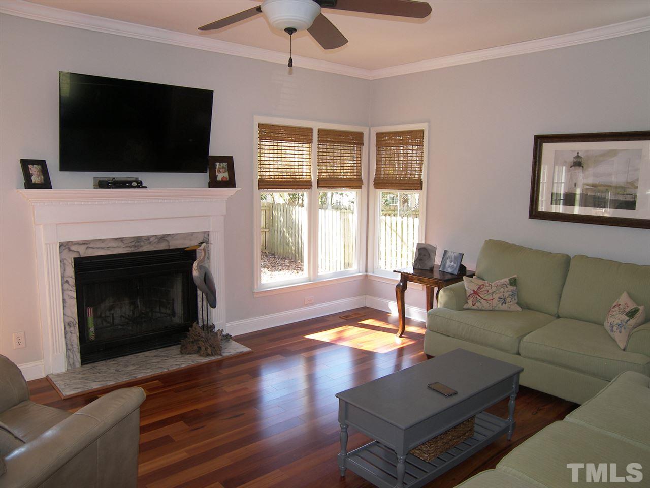 11933 Fairlie Place Raleigh, NC 27613 - Photo 5 of 25 a living room with furniture fireplace and flat screen tv