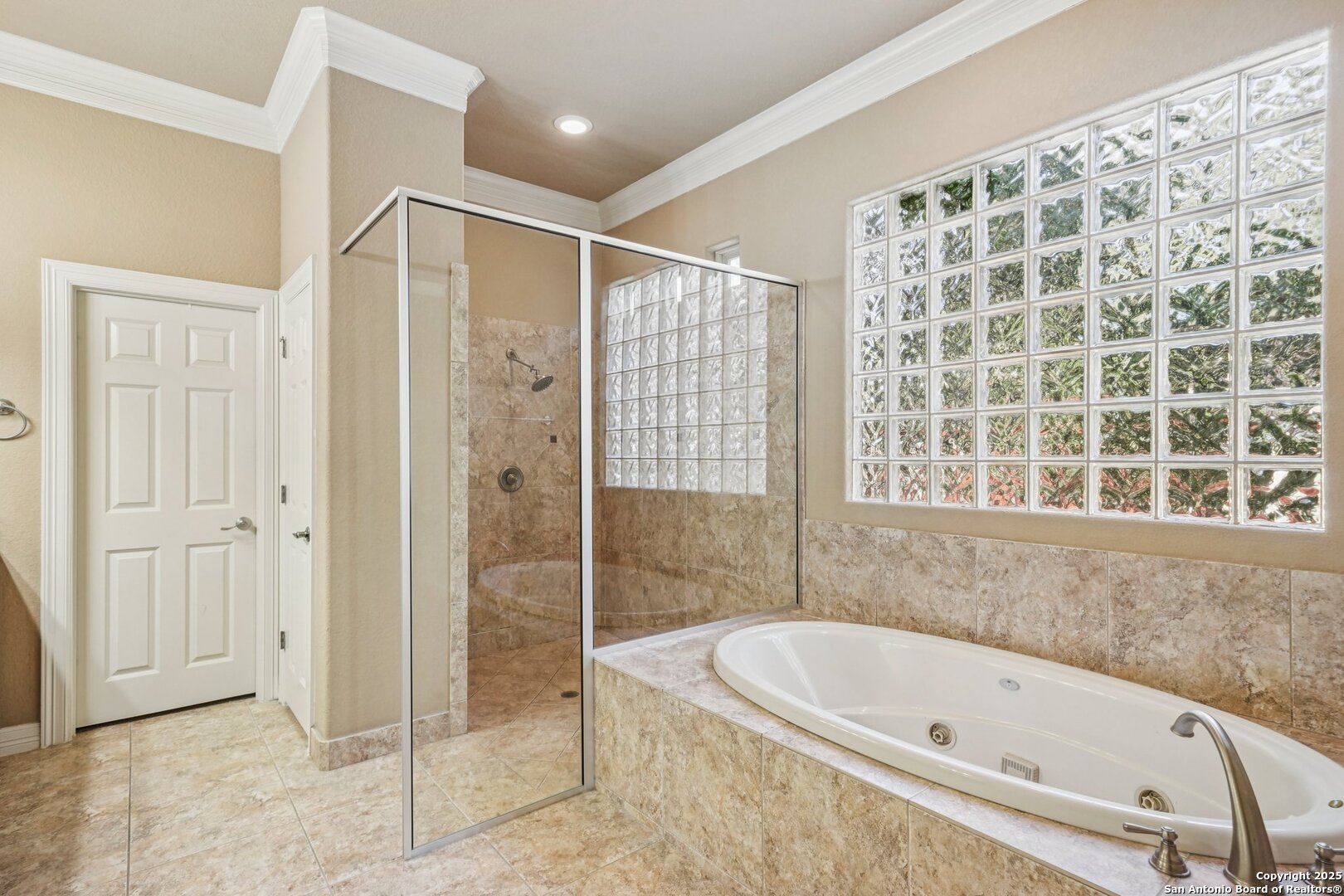 718 Ruidosa Downs Helotes, TX 78023 - Photo 49 of 50 a bathroom with a bathtub and a shower