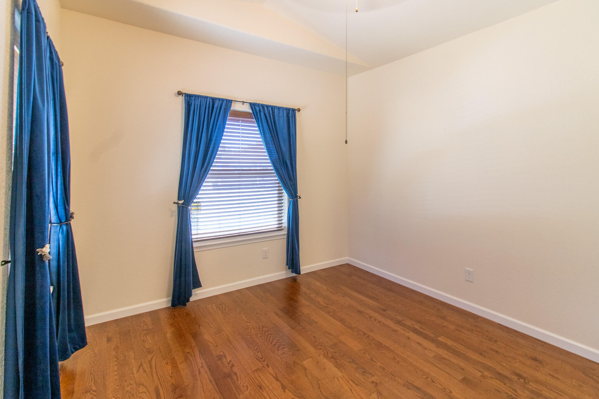 337 Cedar Ridge Drive Cave Junction, OR 97523 - Photo 18 of 56 a view of an empty room with wooden floor and closet