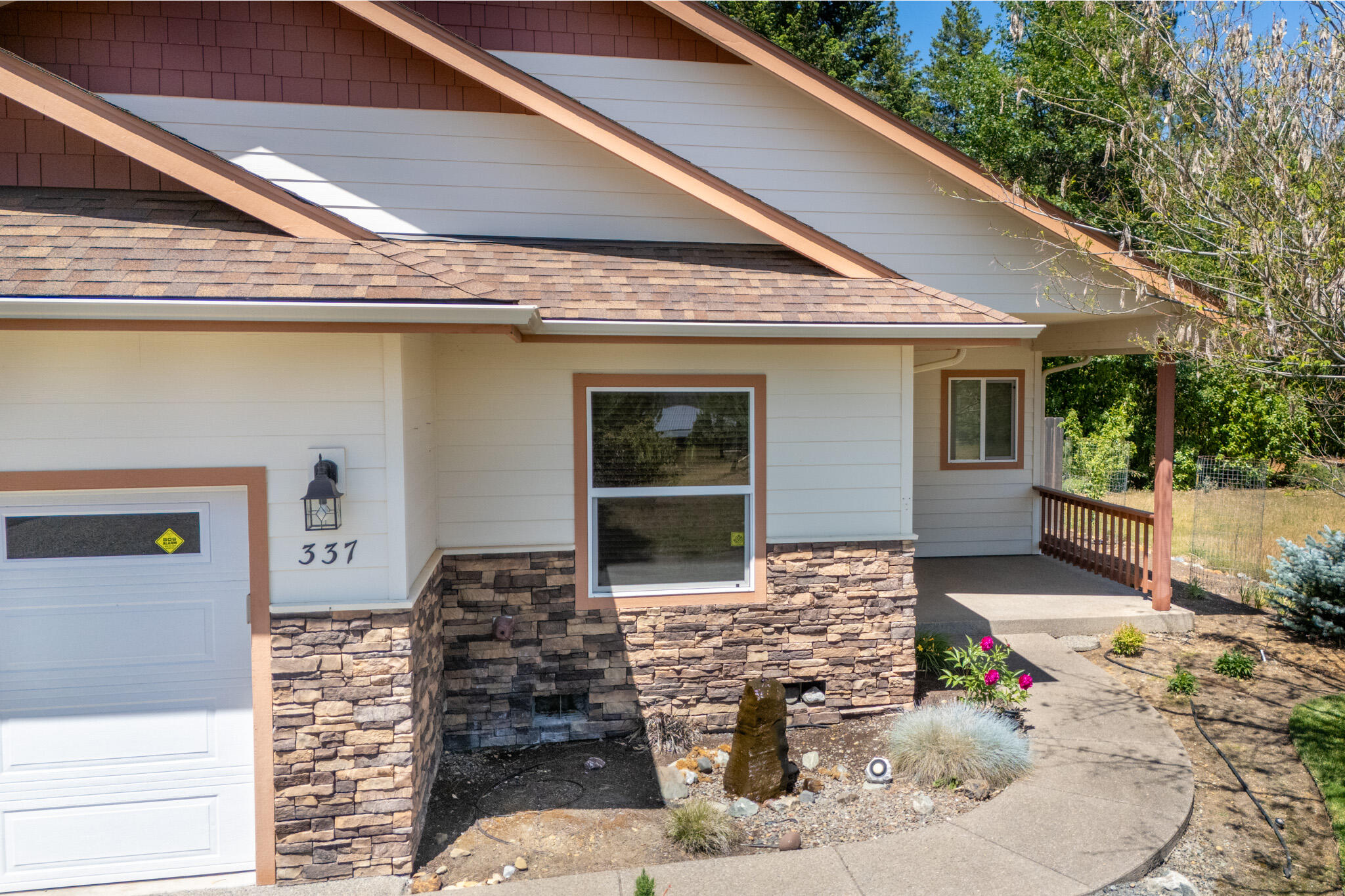 337 Cedar Ridge Drive Cave Junction, OR 97523 - Photo 2 of 56 a front view of a house with windows