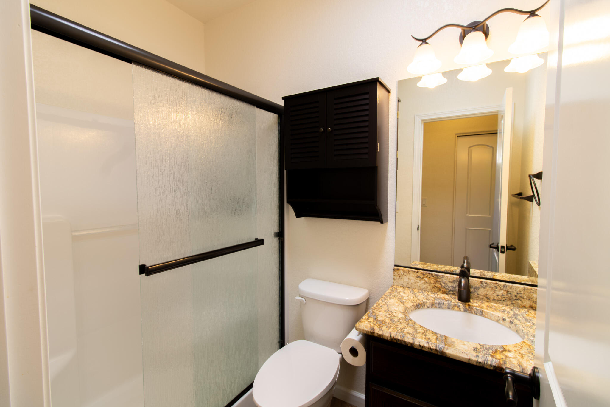 337 Cedar Ridge Drive Cave Junction, OR 97523 - Photo 25 of 56 a bathroom with a sink and a mirror