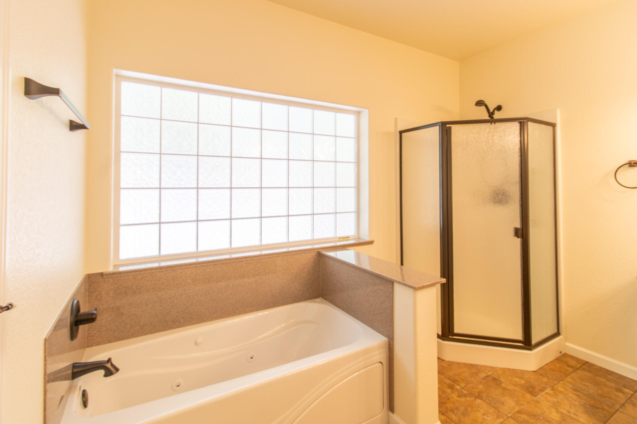 337 Cedar Ridge Drive Cave Junction, OR 97523 - Photo 28 of 56 a bathroom with a bathtub and a shower
