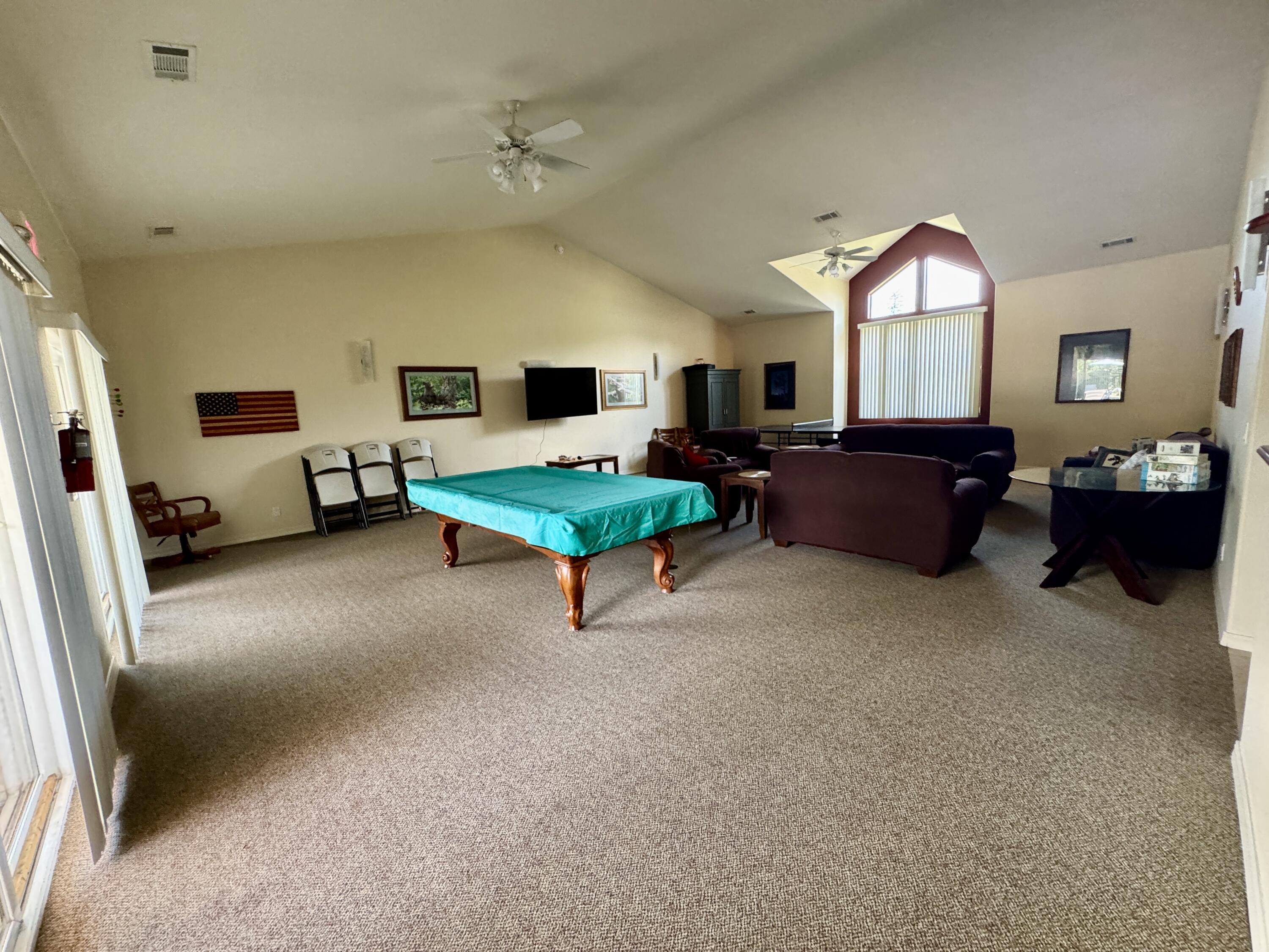 337 Cedar Ridge Drive Cave Junction, OR 97523 - Photo 51 of 56 a living room with furniture and a flat screen tv