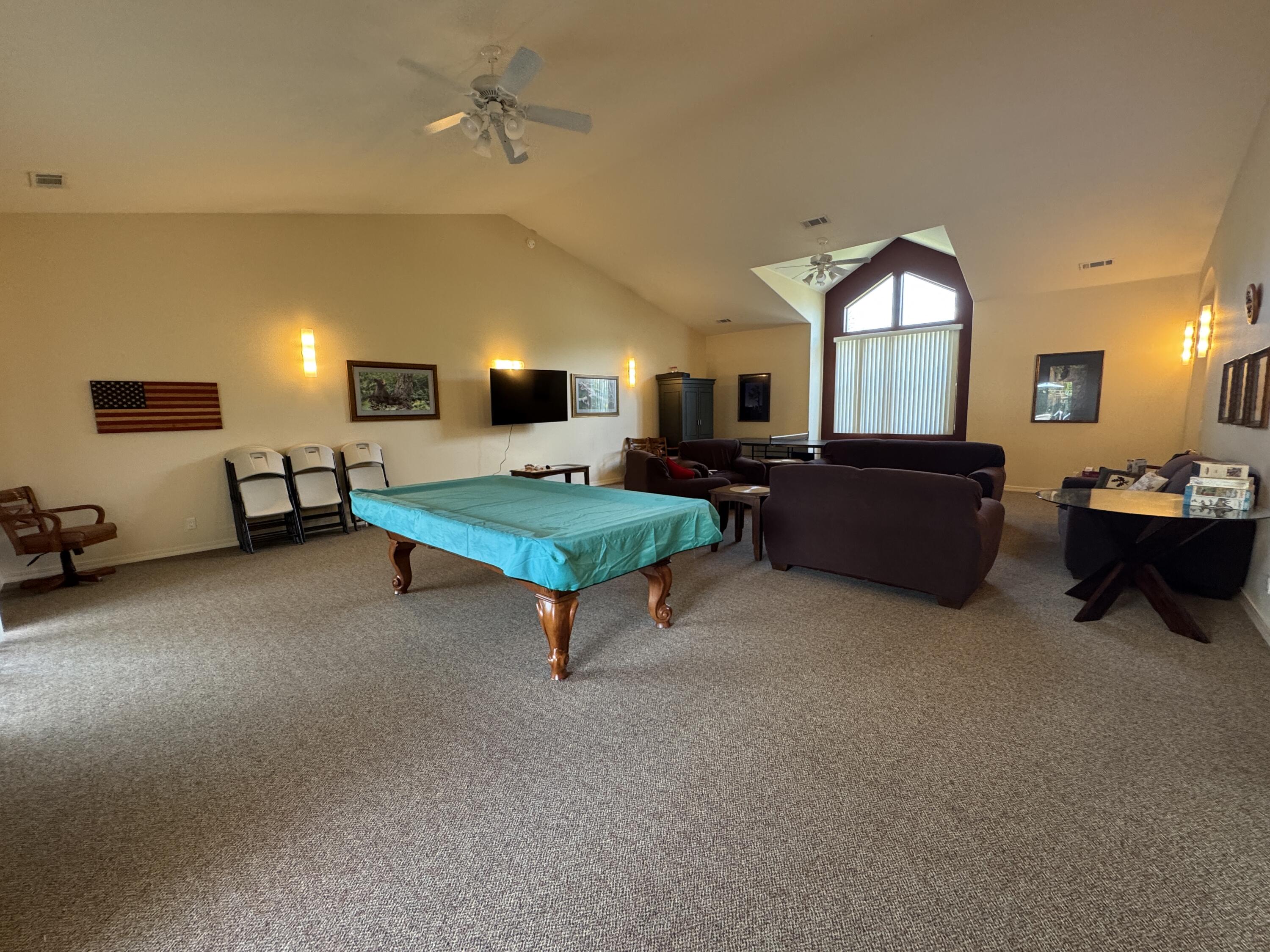 337 Cedar Ridge Drive Cave Junction, OR 97523 - Photo 54 of 56 a living room with furniture and a flat screen tv