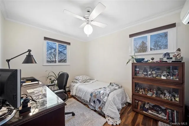 a bedroom with a bed and a television