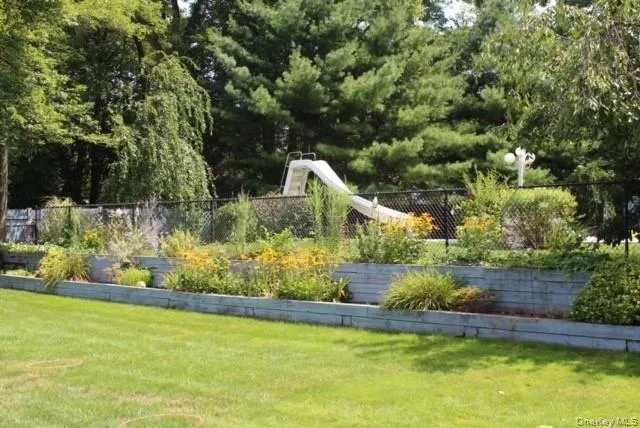 a front view of a house with a yard table and chairs
