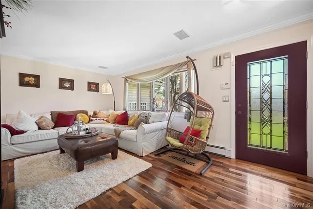 a living room with furniture and a window