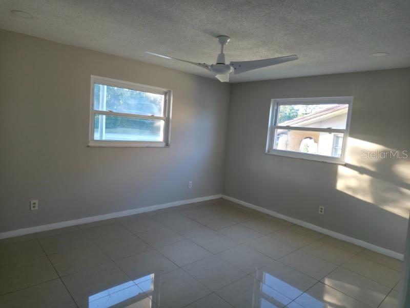 2111 North Keene Road Clearwater, FL 33763 - Photo 11 of 35 a view of an empty room with a window