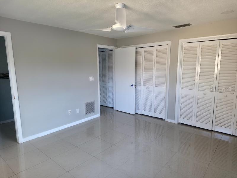 2111 North Keene Road Clearwater, FL 33763 - Photo 12 of 35 an empty room with windows and closet