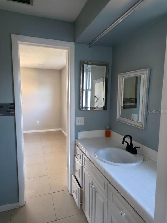 2111 North Keene Road Clearwater, FL 33763 - Photo 15 of 35 a bathroom with a sink and a mirror