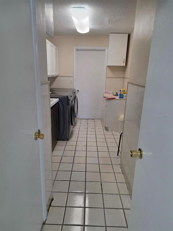 2111 North Keene Road Clearwater, FL 33763 - Photo 35 of 35 a view of a hallway with washer and dryer