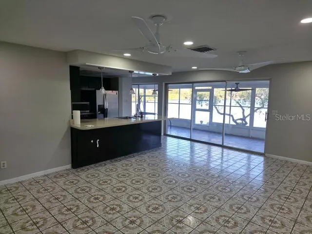 a view of a kitchen and a window