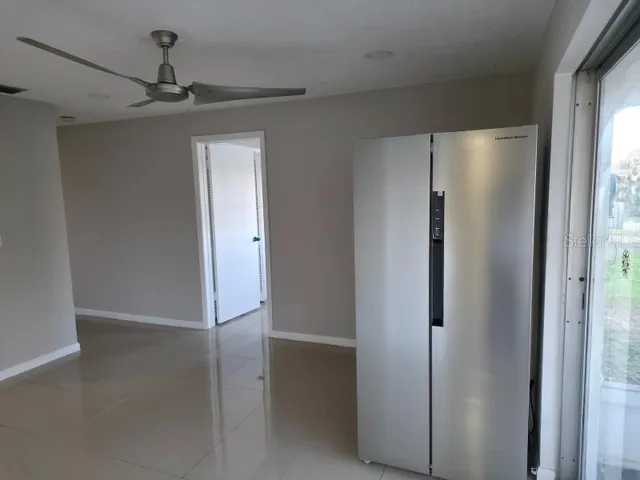 a view of a refrigerator in a kitchen