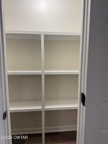 a view of room with a fan