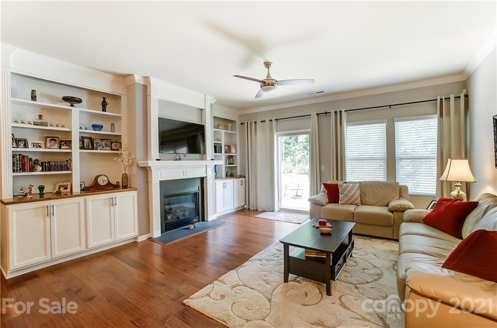 1765 Still River Way Fort Mill, SC 29708 - Photo 19 of 46 a living room with furniture a fireplace and a flat screen tv