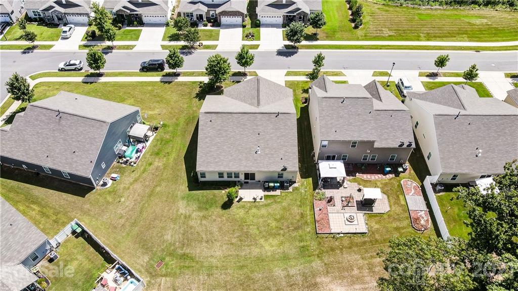 1765 Still River Way Fort Mill, SC 29708 - Photo 3 of 46 an aerial view of residential houses with outdoor space and swimming pool