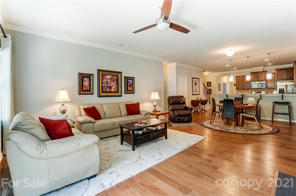 1765 Still River Way Fort Mill, SC 29708 - Photo 21 of 46 a living room with furniture kitchen view and a wooden floor