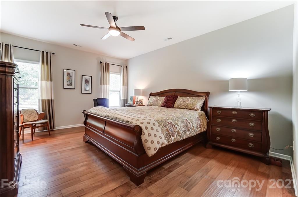 1765 Still River Way Fort Mill, SC 29708 - Photo 23 of 46 a bedroom with a bed and wooden floor