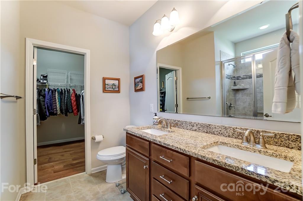 1765 Still River Way Fort Mill, SC 29708 - Photo 25 of 46 a spacious bathroom with a granite countertop sink a toilet and a shower