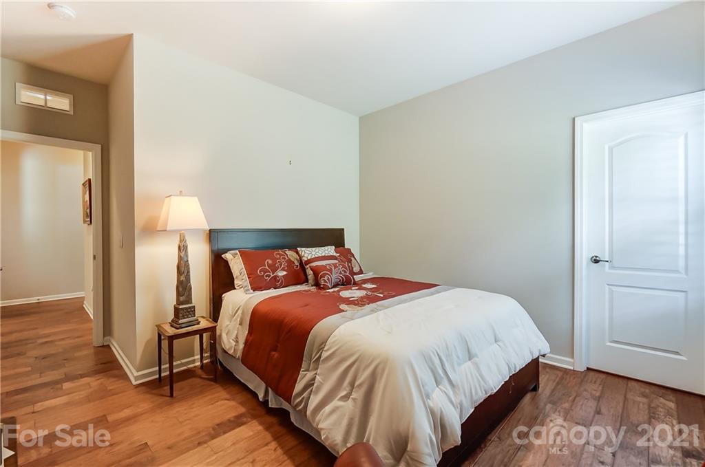 1765 Still River Way Fort Mill, SC 29708 - Photo 27 of 46 a bedroom with a bed and wooden floor