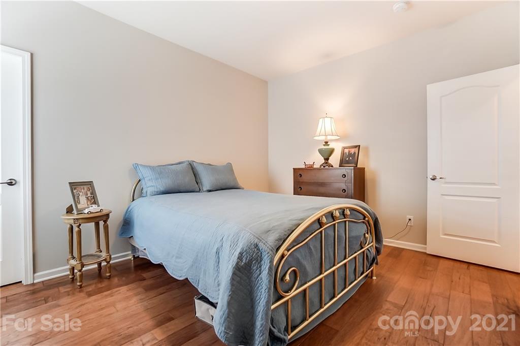 1765 Still River Way Fort Mill, SC 29708 - Photo 29 of 46 a bedroom with a bed and wooden floor
