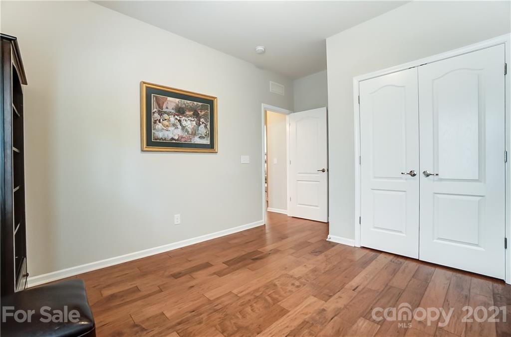 1765 Still River Way Fort Mill, SC 29708 - Photo 33 of 46 an empty room with wooden floor and closet