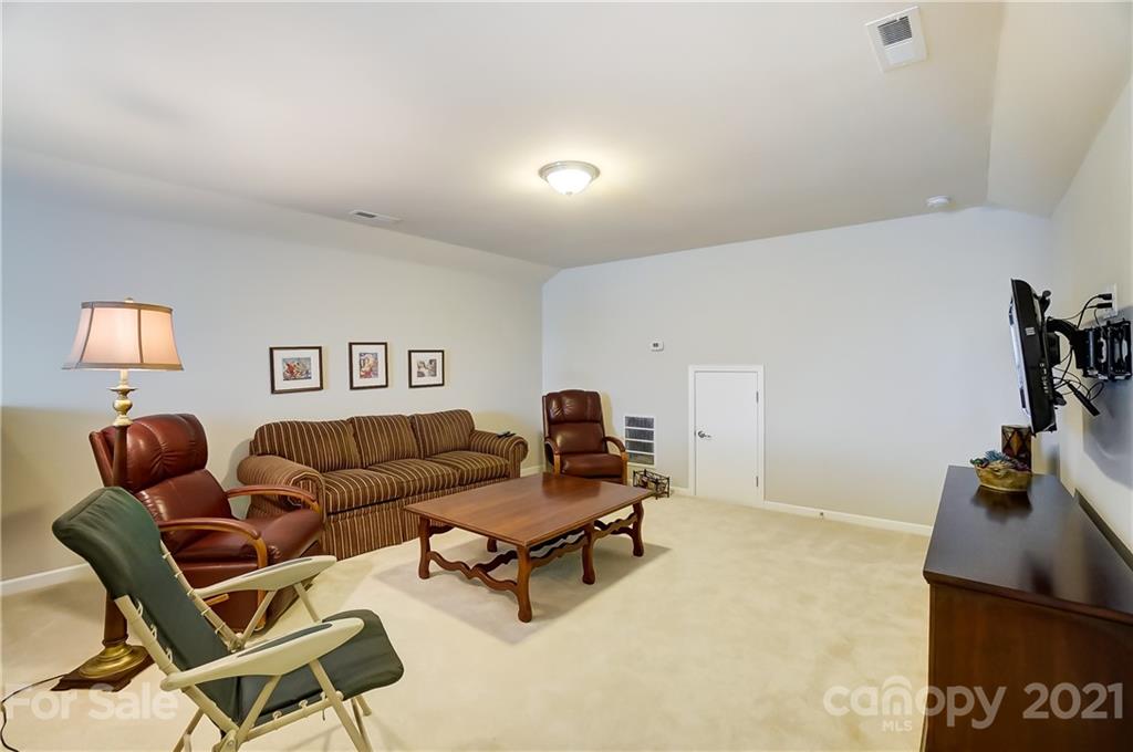 1765 Still River Way Fort Mill, SC 29708 - Photo 36 of 46 a living room with furniture and a flat screen tv
