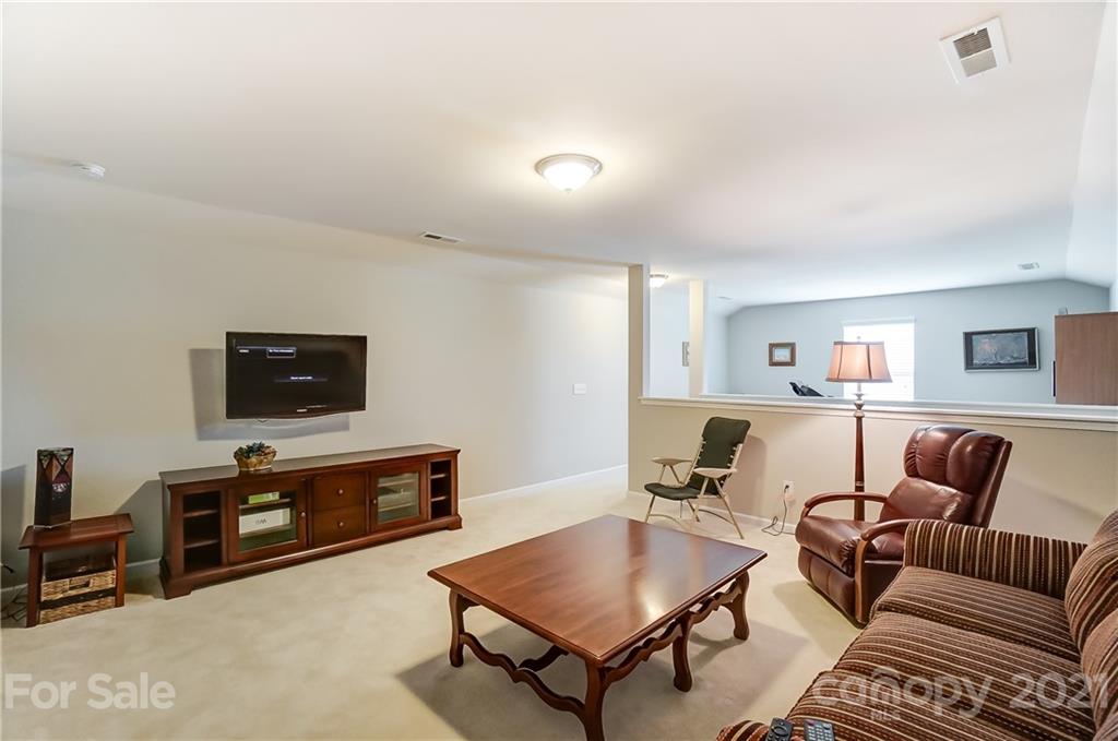 1765 Still River Way Fort Mill, SC 29708 - Photo 38 of 46 a living room with furniture and a flat screen tv