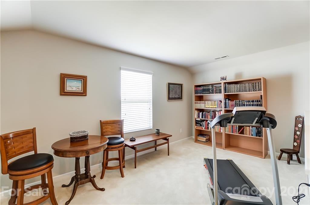 1765 Still River Way Fort Mill, SC 29708 - Photo 39 of 46 a bedroom with furniture and a book shelf