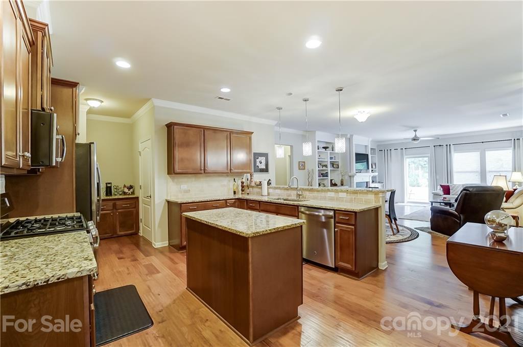 1765 Still River Way Fort Mill, SC 29708 - Photo 10 of 46 a large kitchen with kitchen island a sink counter space and stainless steel appliances
