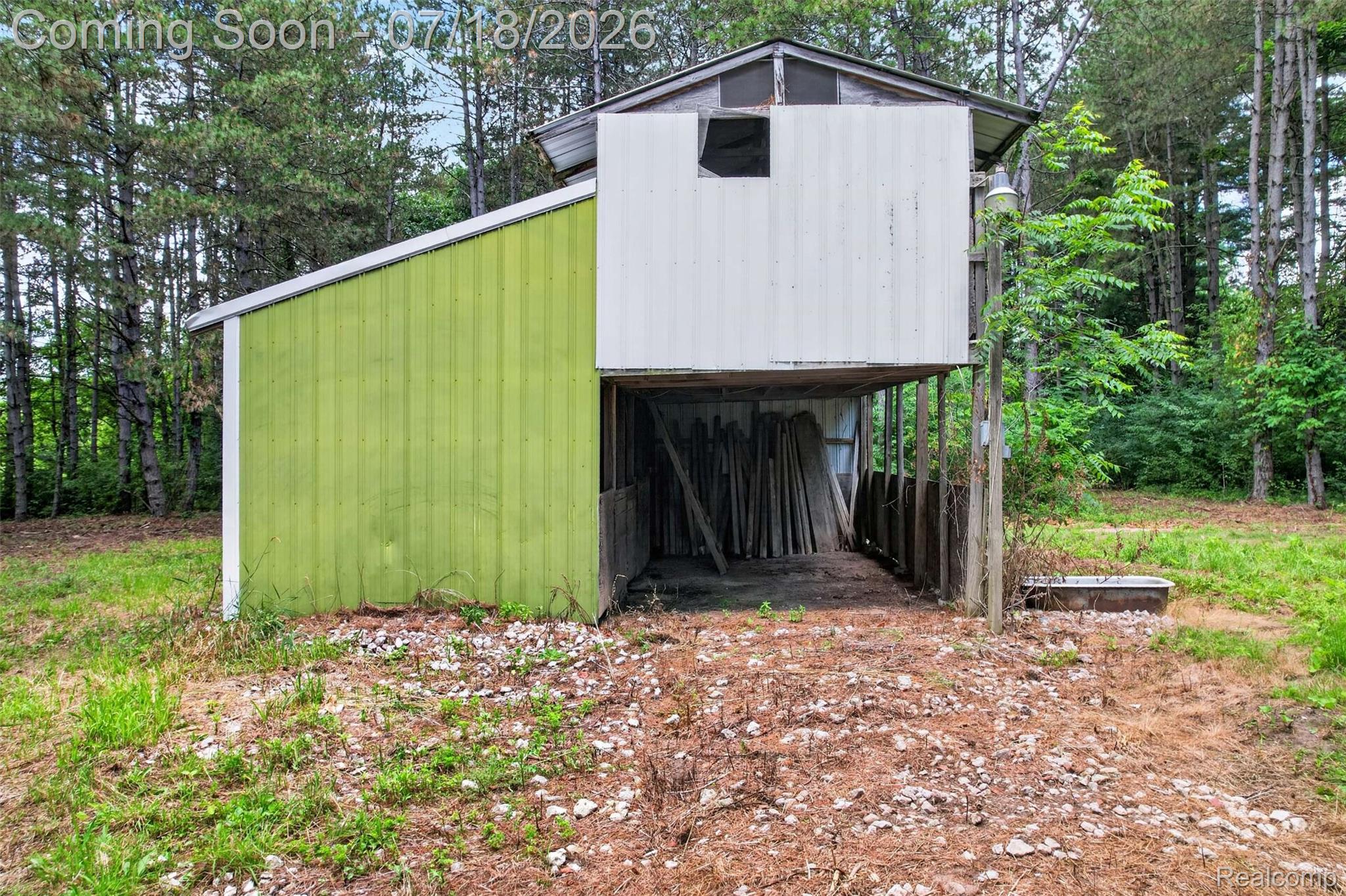 1437 East Cook Road Grand Blanc, MI 48439 - Photo 19 of 69 Two-tone outbuilding featuring a green board-and-batten side and a white metal-sided upper structure