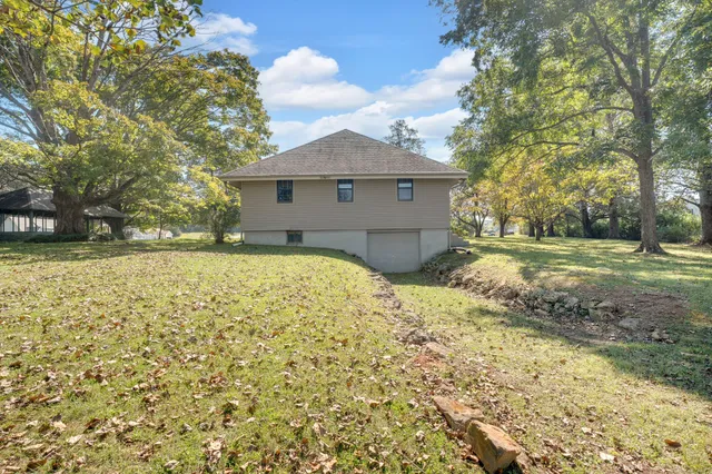 a view of outdoor space with trees all around