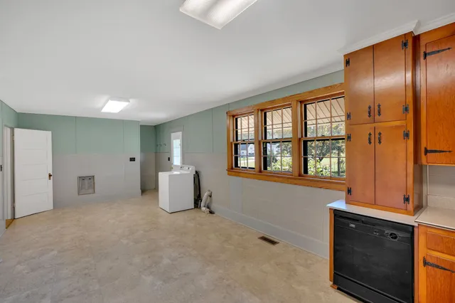 a view of a livingroom with furniture and a window