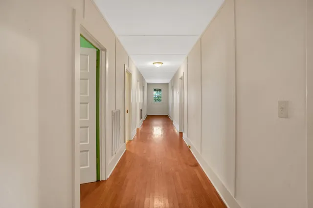 a room with a bunk bed and a window