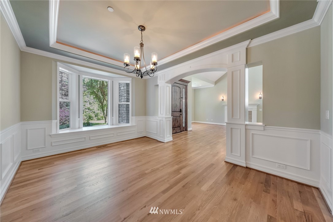 17725 Southeast 123rd Place Renton, WA 98059 - Photo 12 of 37 a view of a livingroom with wooden floor and chandelier