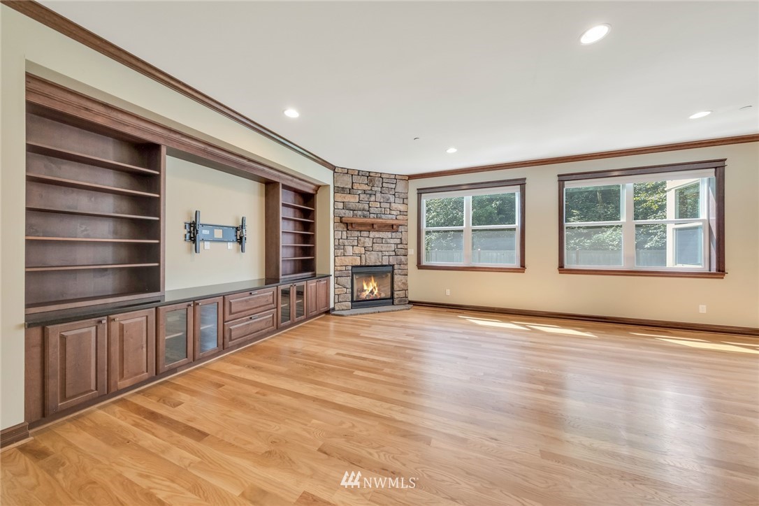17725 Southeast 123rd Place Renton, WA 98059 - Photo 14 of 37 a view of an empty room with a window and wooden floor