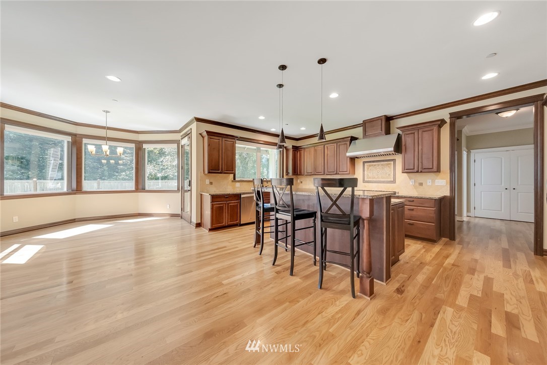 17725 Southeast 123rd Place Renton, WA 98059 - Photo 15 of 37 a view of a kitchen with furniture and wooden floor